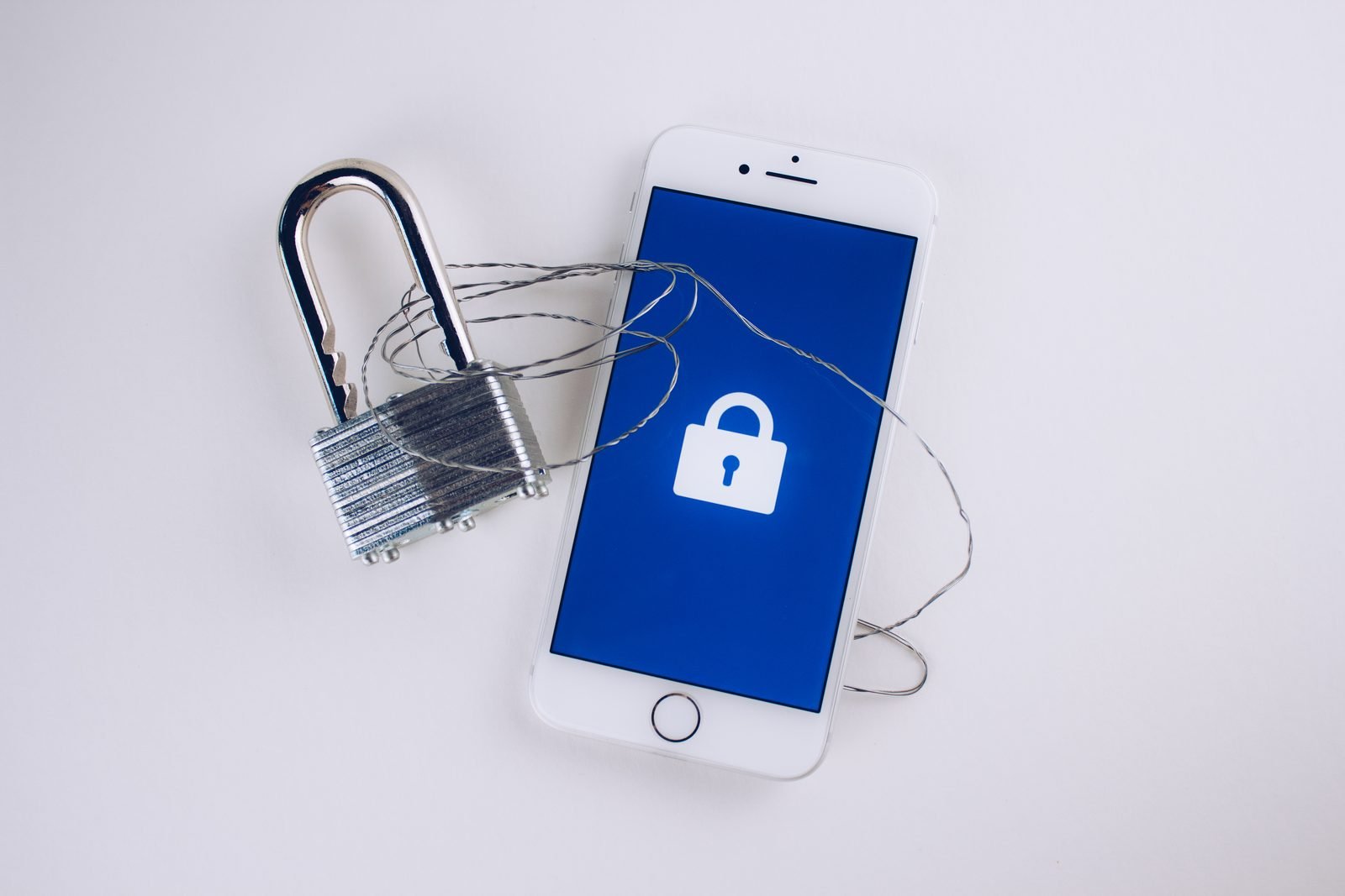 An open padlock and a smartphone displaying a lock icon, symbolizing password and account security