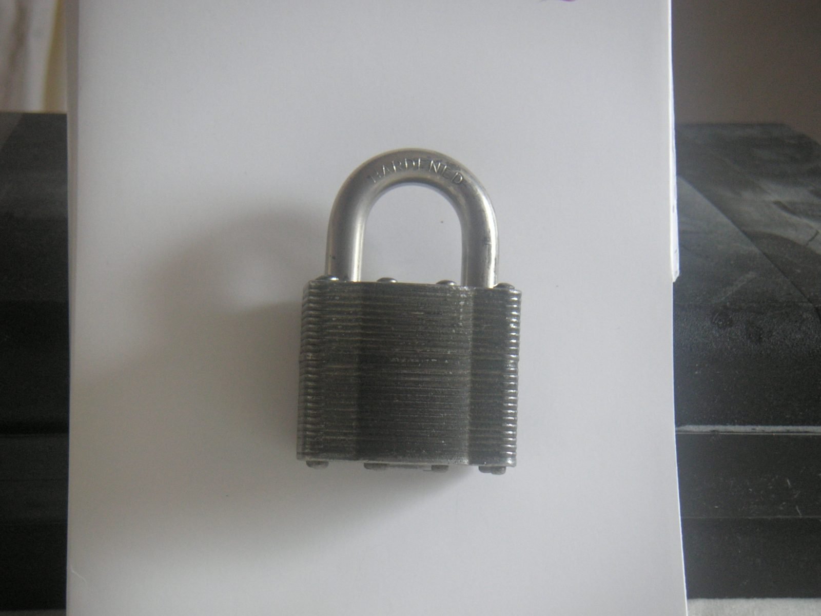 Close-up of a locked brass padlock symbolizing a password-protected PDF document