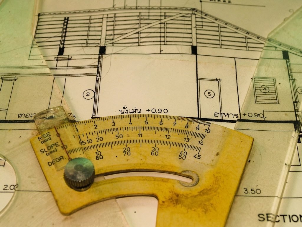 Architectural blueprint drawing with a slope protractor tool used for technical drafting